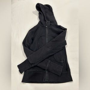 Black lululemon zip up hoodie.